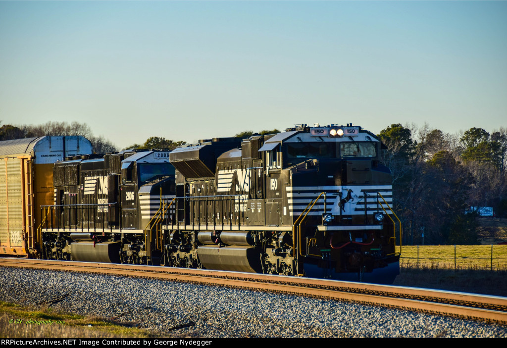 NS #1150 & 2806 are leading a waiting mixed freight train